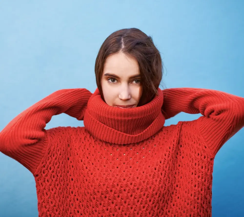 A young woman who is and enjoy wearing free people sweaters
